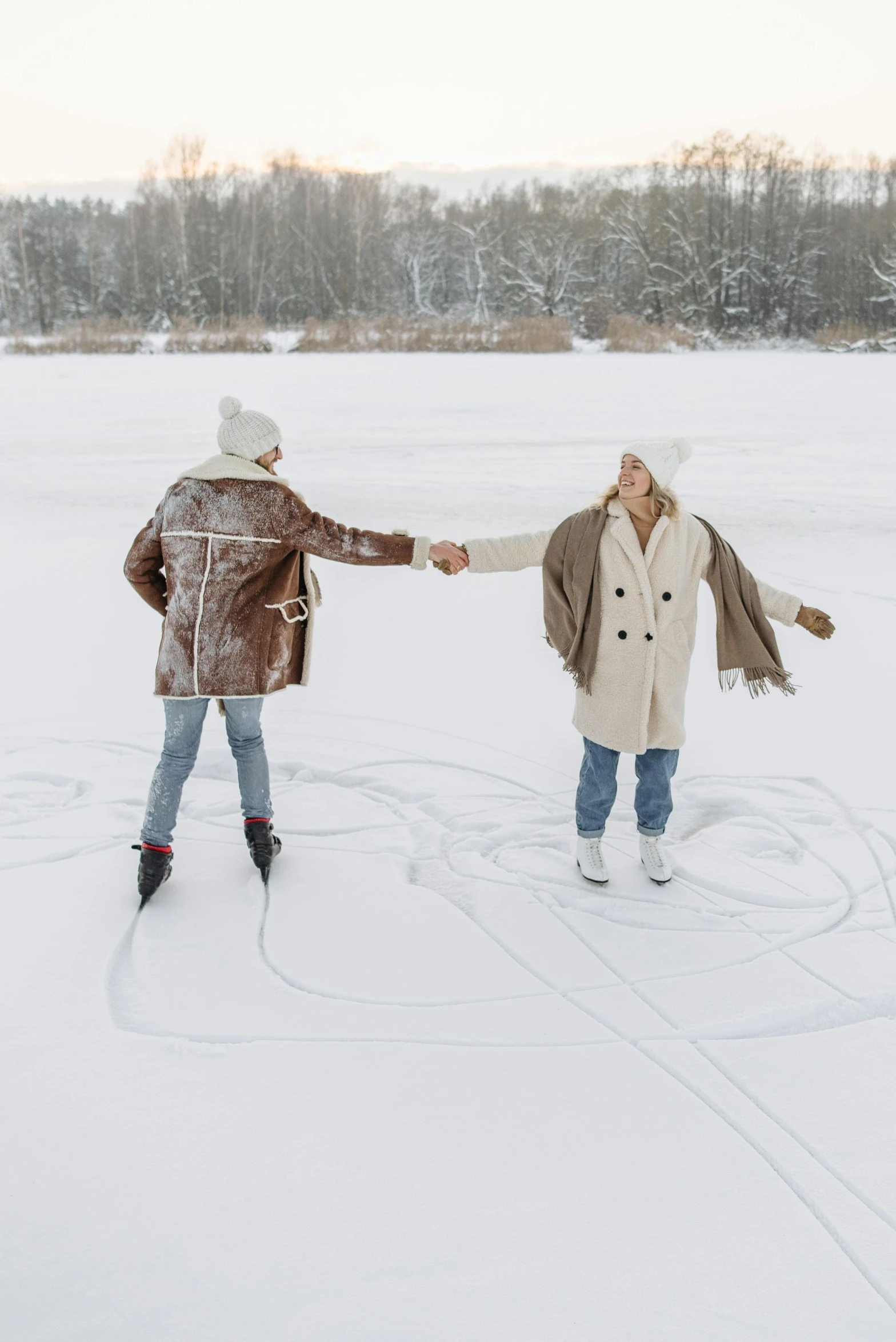 two people walking in the snow holding hands, trending on pexels, land art, on a lake, dynamic skating, line drawn, model posing