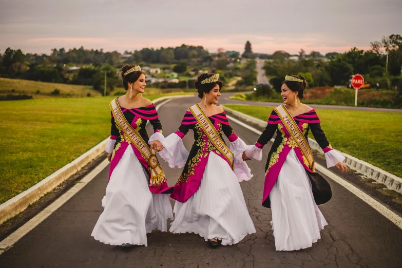 a group of women walking down a road, an album cover, pexels contest winner, happening, ornate royal robes, puerto rico, manuka, authentic costume