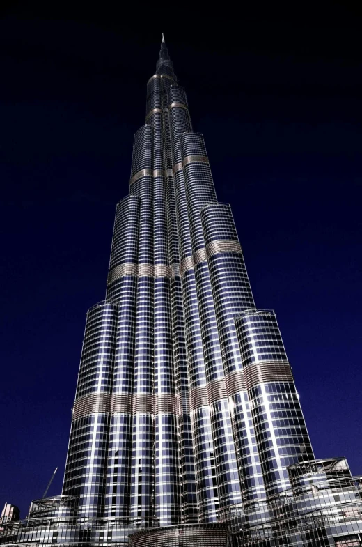 the burjra is the tallest building in the world, an album cover, award-winning”, photorealistic ”, dramatic lighting”