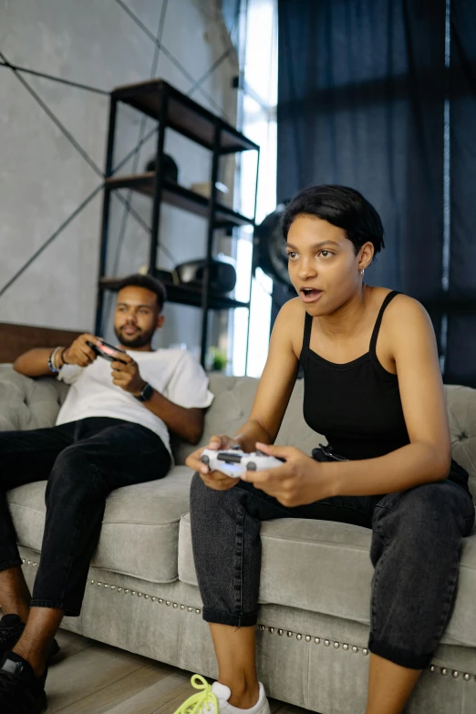 a couple of people that are sitting on a couch, pexels contest winner, video game icon, women fighting men, photo of a black woman, shocked expression on her face