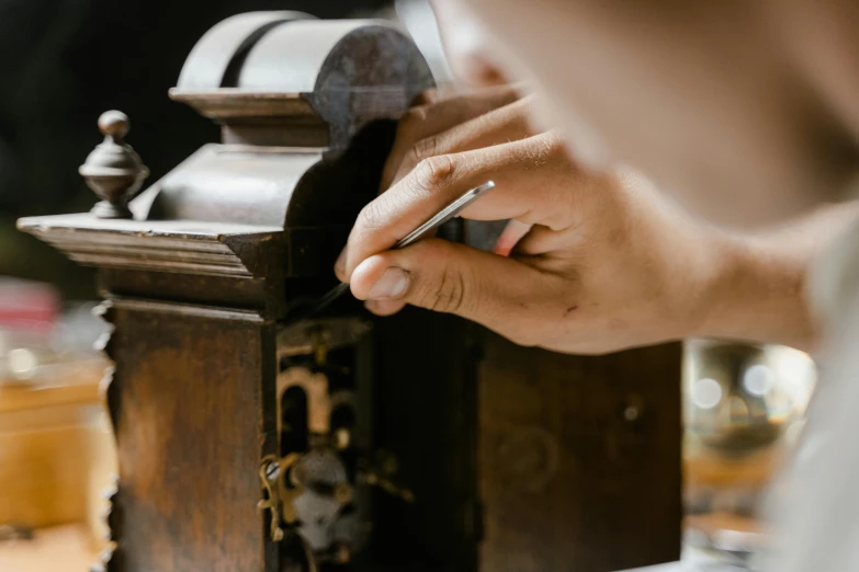 a close up of a person holding a cigarette, pexels contest winner, arts and crafts movement, ancient coffee machine, repairing the other one, lacquerware, thumbnail