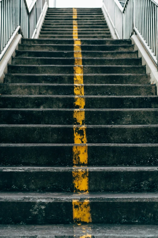 a man riding a skateboard down a flight of stairs, pexels contest winner, postminimalism, charcoal and yellow leather, road, lined up horizontally, stone stairway