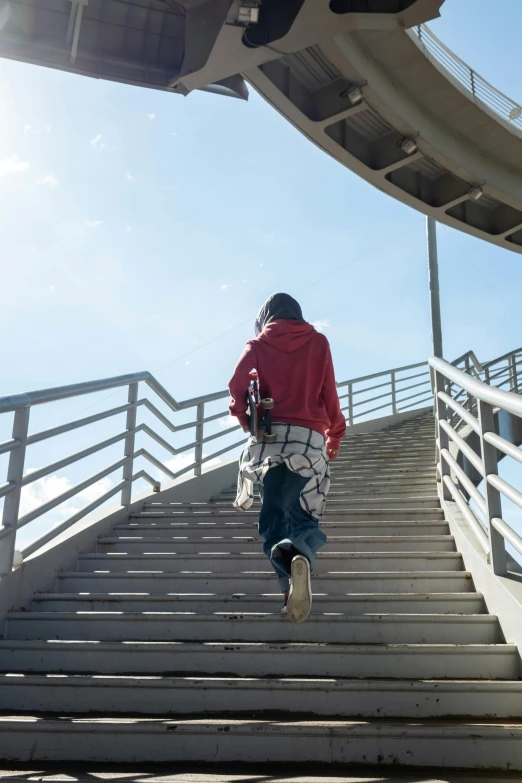 a man flying through the air while riding a skateboard, an album cover, trending on unsplash, happening, outdoor staircase, standing with her back to us, full frame image, standing in a stadium