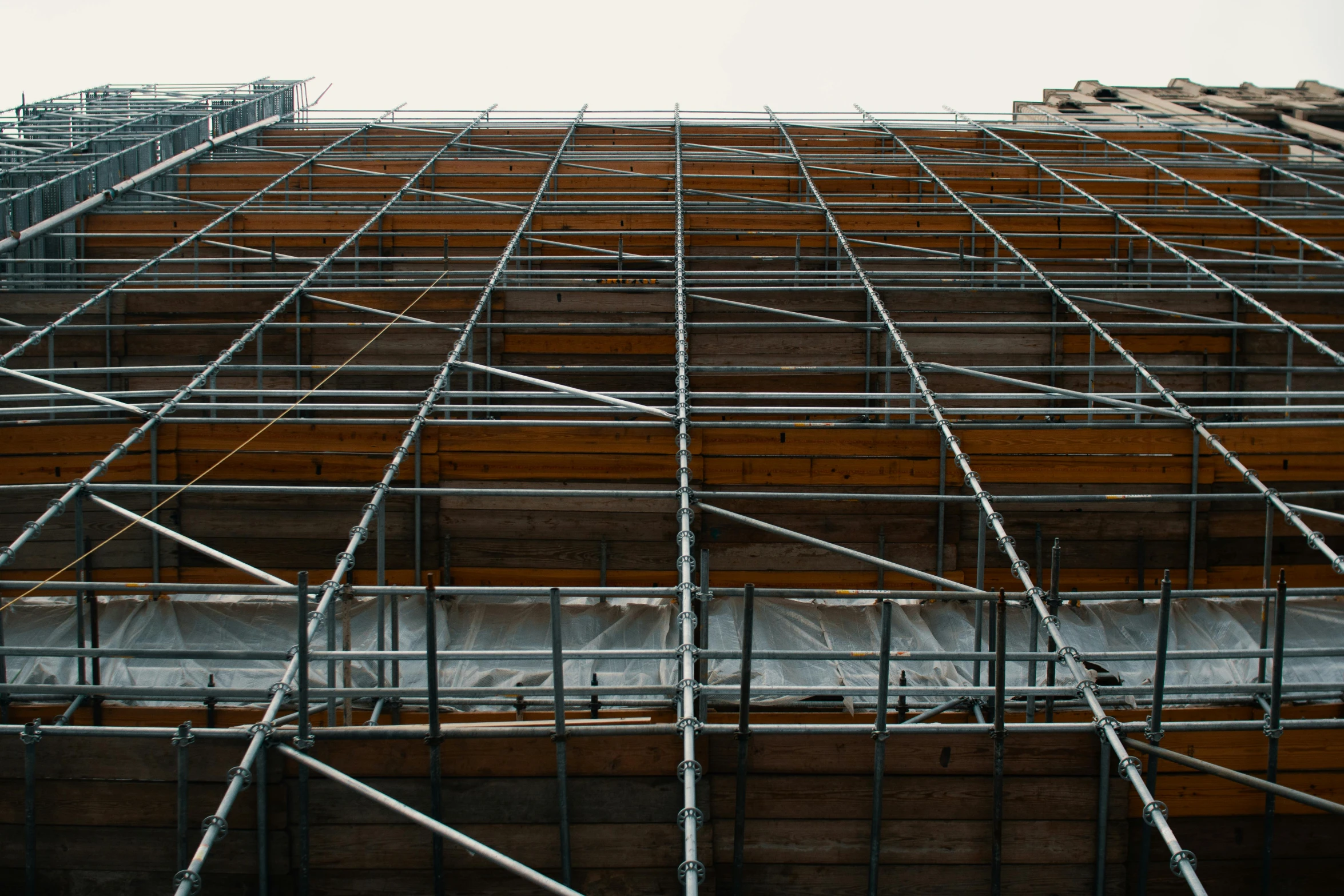 a very tall building with a lot of scaffolding, a portrait, unsplash, renaissance, brown, rectangular, grey