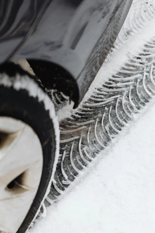 a close up of a car tire on a snowy road, ultraclear intricate, award-winning style, underbody, thick lining