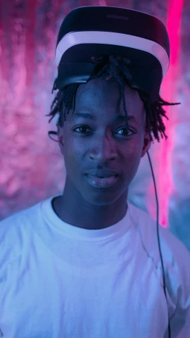 a close up of a person wearing a hat, trending on pexels, afrofuturism, playboi carti portrait, vibrant lights, grey skinned, with head phones
