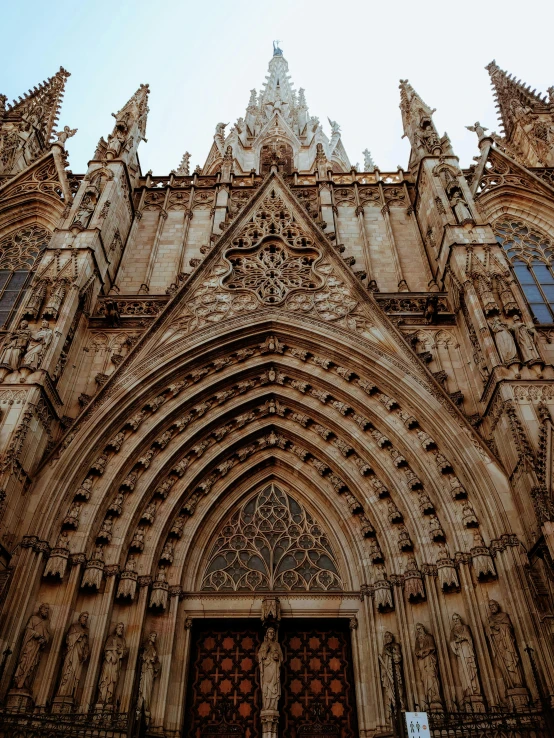 a group of people standing in front of a cathedral, by Gaudi, pexels contest winner, intricate details. front on, gothic quarter, marilyn church h, frontal picture