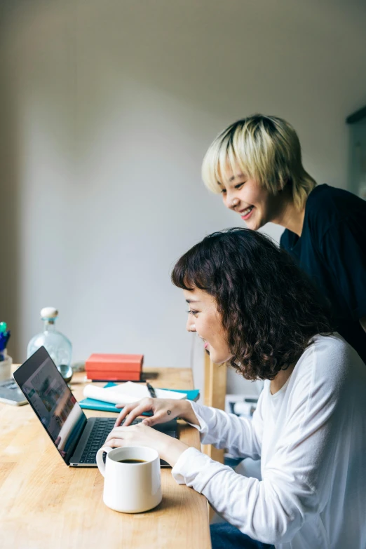 two women sitting at a table with a laptop, trending on unsplash, happening, japanese, avatar image, document photo, a blond