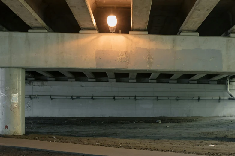 a red fire hydrant sitting under a bridge, a portrait, inspired by Robert Bechtle, unsplash, todd hido, ignant, streetlamps, concrete hitech interior