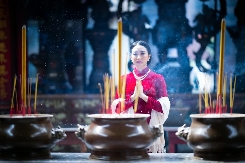 a woman in a red dress is praying, inspired by Hu Zao, pexels contest winner, on the altar, avatar image, incense, concert