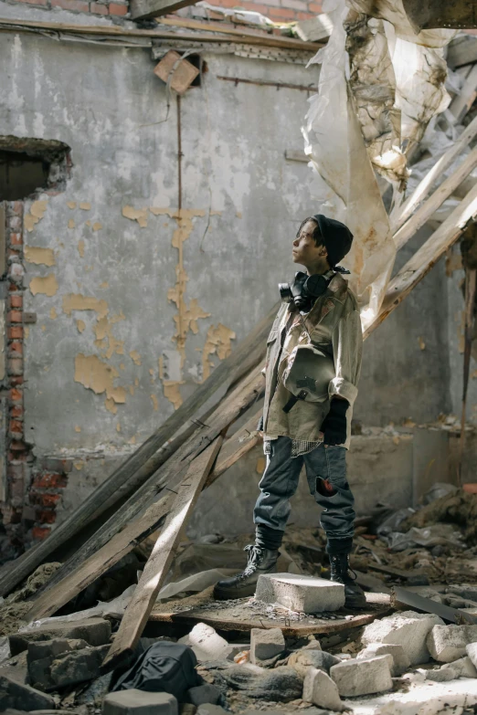 a man standing on top of a pile of rubble, inspired by Zhang Kechun, pexels contest winner, visual art, portrait of willow smith, standing in an alleyway, film still from the movie, ethiopian civil war