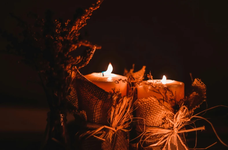 a couple of candles sitting on top of a table, trending on pexels, romanticism, witchy clothing, profile image, harvest, wreathed in flame