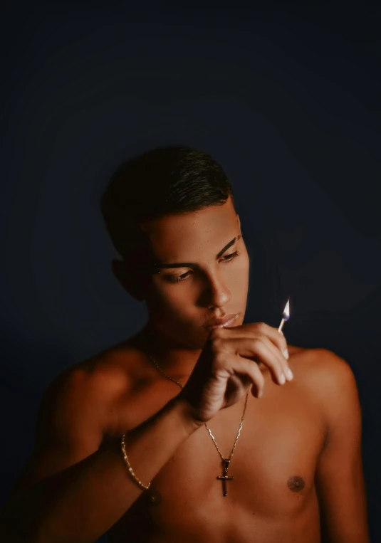 a shirtless young man smoking a cigarette, an album cover, inspired by Elsa Bleda, trending on pexels, thiago alcantara, single light, teen boy, profile pic