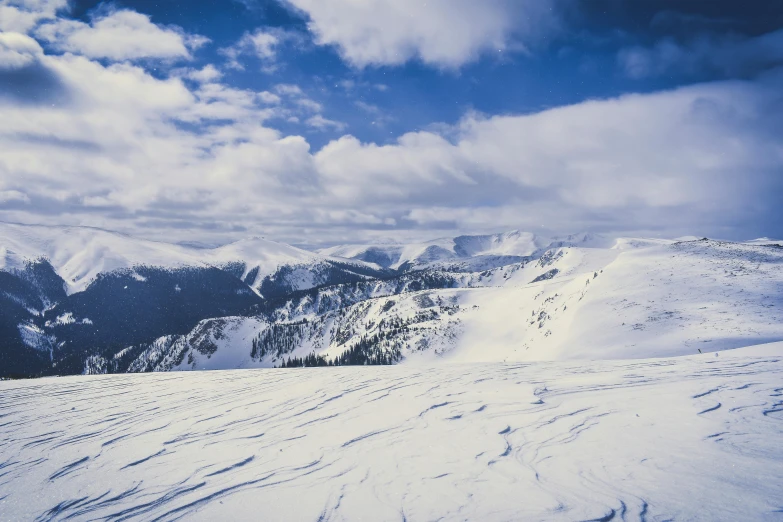 a person riding skis on top of a snow covered slope, visual art, landscape photo, 90s photo, 9 9 designs, british columbia