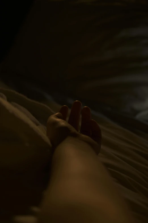 a person laying on a bed under a full moon, inspired by Elsa Bleda, unsplash, holding hands, todd hido, movie still 8 k, low angle
