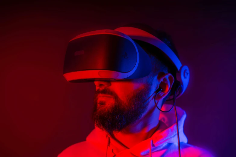 a man with a beard wearing a virtual reality headset, by Adam Marczyński, pexels, hyperrealism, light red and deep blue mood, leds visor helmet, gaming headset, ((raytracing))