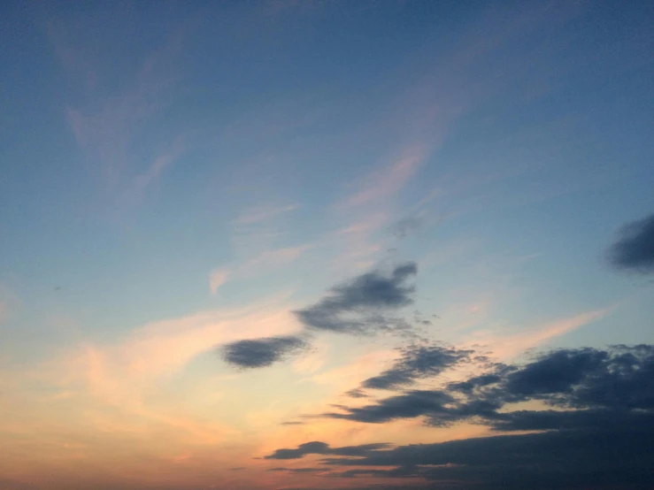 a large body of water under a cloudy sky, a picture, unsplash, romanticism, ((sunset)), major arcana sky, plain uniform sky, summer night