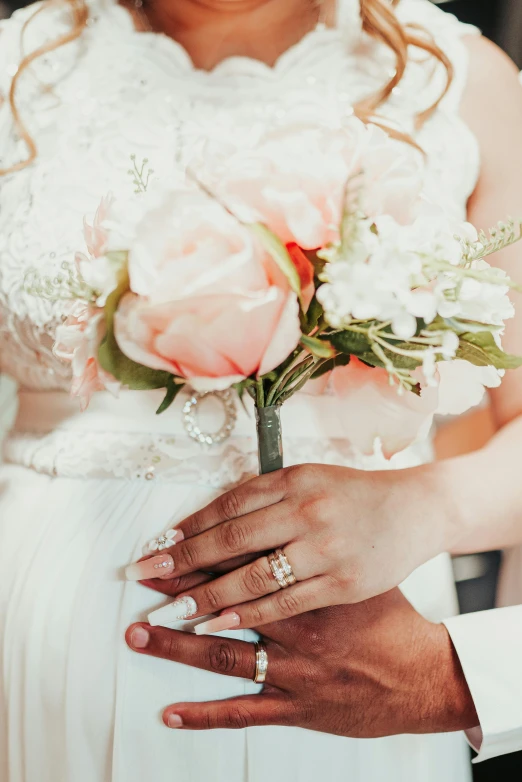 a close up of a person holding a bouquet, holding each other hands, peach embellishment, multiple stories, wedding