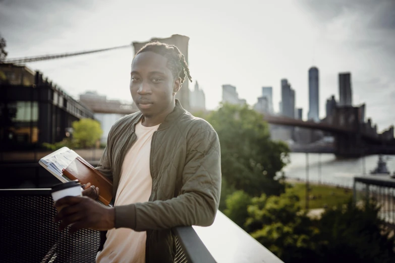 a man standing on a bridge reading a book, a portrait, by Joseph Severn, pexels contest winner, beautiful city black woman only, brooklyn background, avatar image, male teenager