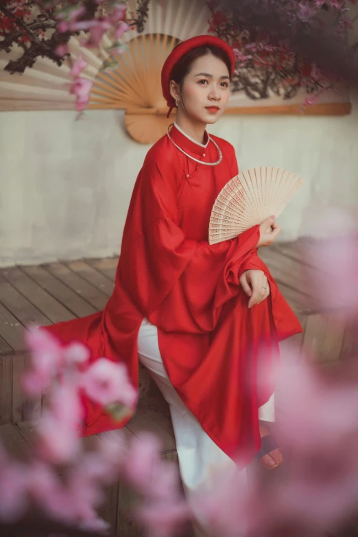 a woman in a red dress holding a fan, inspired by Gu An, pexels contest winner, wearing a simple robe, bao phan, casual clothing style, 💣 💥