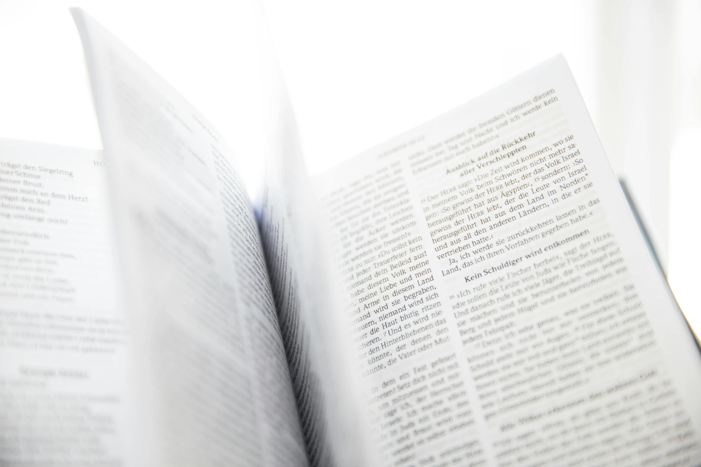 an open book sitting on top of a table, high key, readability, upclose, descriptions