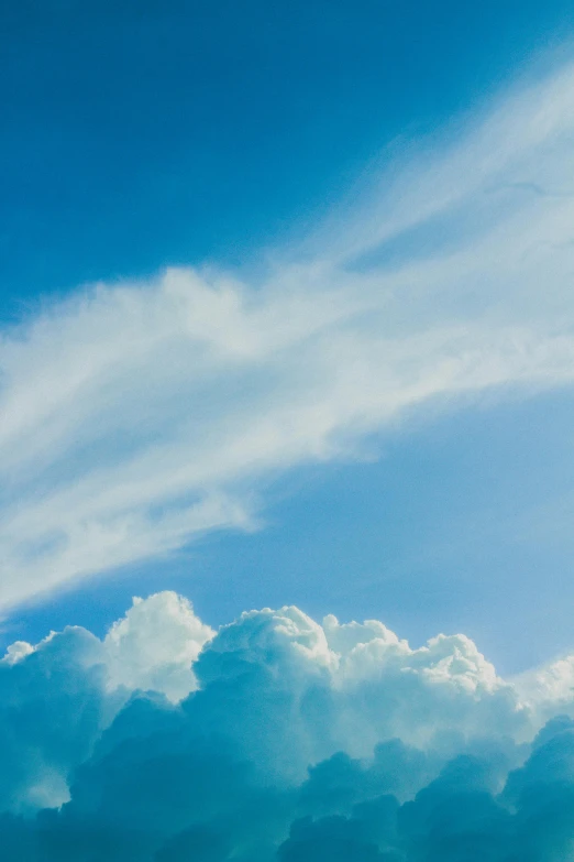 a jetliner flying through a blue cloudy sky, unsplash, minimalism, tall fluffy clouds, angels in the sky, profile image