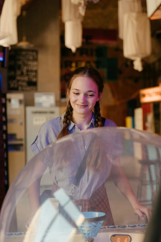 a woman that is inside of a bubble, joey king, in the pub, holding an umbrella, at checkout