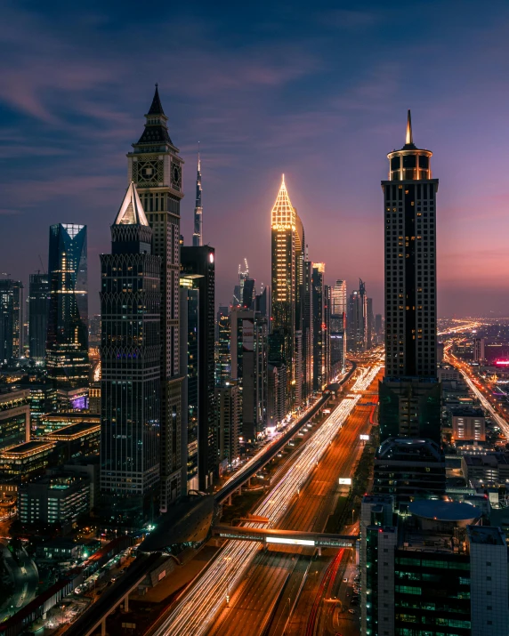 an aerial view of a city at night, pexels contest winner, dubai, skyscrapers on the background, dusk on a city street, three towers