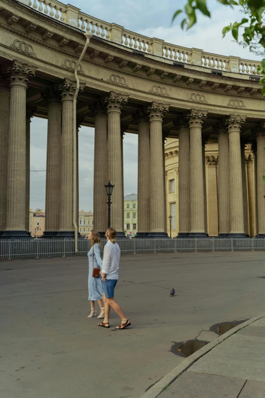 a couple of people that are standing in front of a building, a picture, in moscow centre, colonnade, round corners, exterior