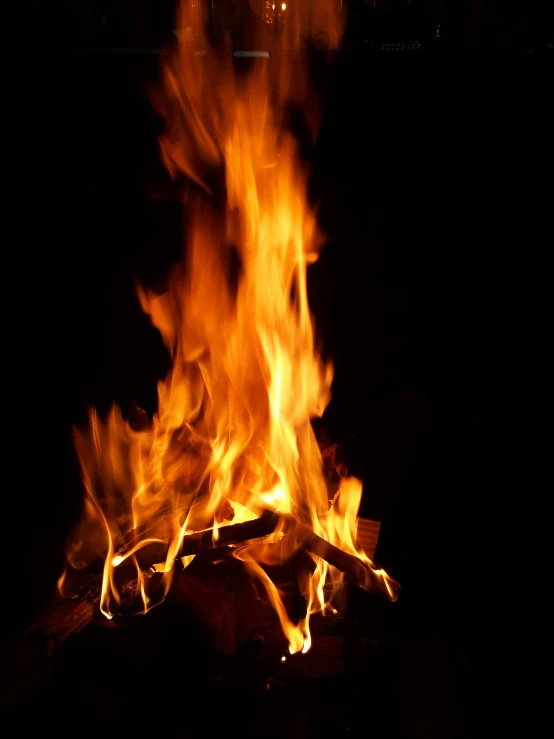 a close up of a fire in the dark, pexels, hurufiyya, irori fireplace, profile image, multiple stories, outdoor photo