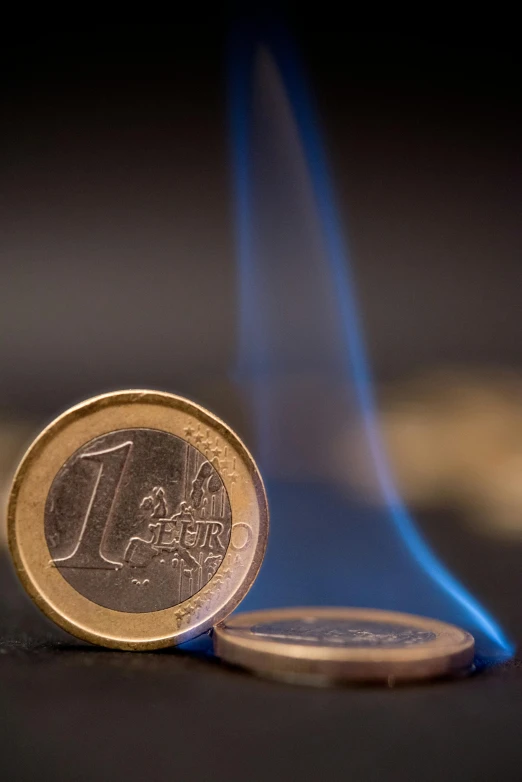 a one euro coin sitting on top of a blue flame, by Matthias Stom, pexels contest winner, rising steam, ir, thumbnail, full frame image