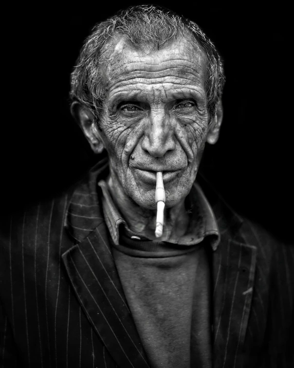 a man with a cigarette in his mouth, inspired by Lee Jeffries, style steve mccurry, “portrait of leonard cohen, thin long fine lines, kerem beyit