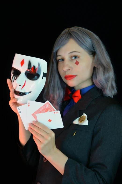 a woman holding a mask and playing cards, featured on reddit, in a suit, discord profile picture, ekaterina, profile image