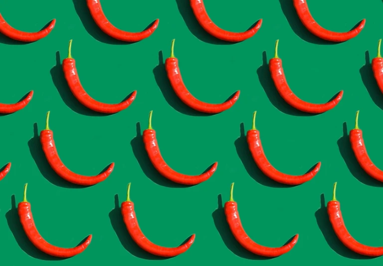 red chili peppers on a green background, by Julia Pishtar, trending on pexels, pop art, background image, repeating pattern, eight eight eight, sausage