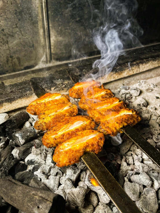 a bunch of food that is on a grill, at night, profile image, press shot, crispy