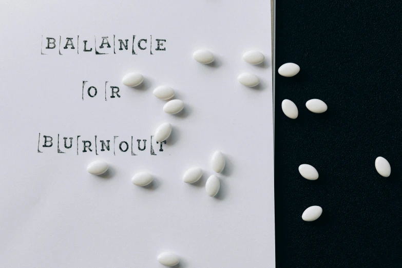 a book with the words balance for burnout written on it, an album cover, by Nina Hamnett, pills, 5 mm, on simple background, monaco