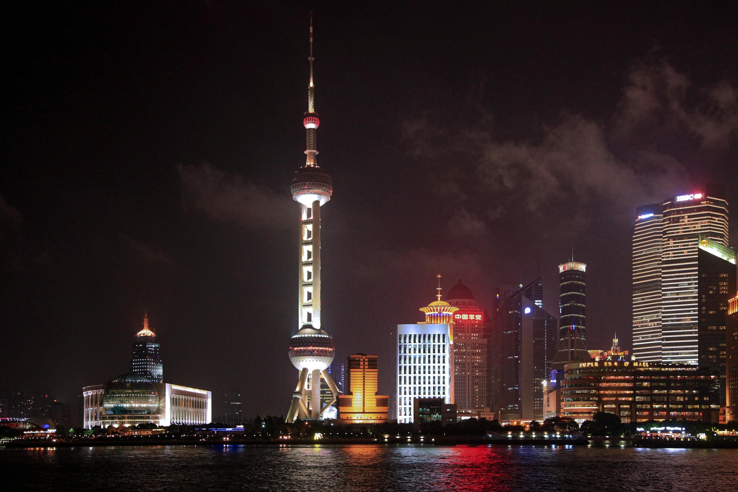 the oriental city skyline is lit up at night, by Zha Shibiao, pexels contest winner, happening, promo image, shanghai, viewed from the harbor, 2000s photo