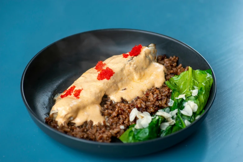 a close up of a plate of food on a table, by Julia Pishtar, in a red dish, kete butcher, lava rock, cheesy