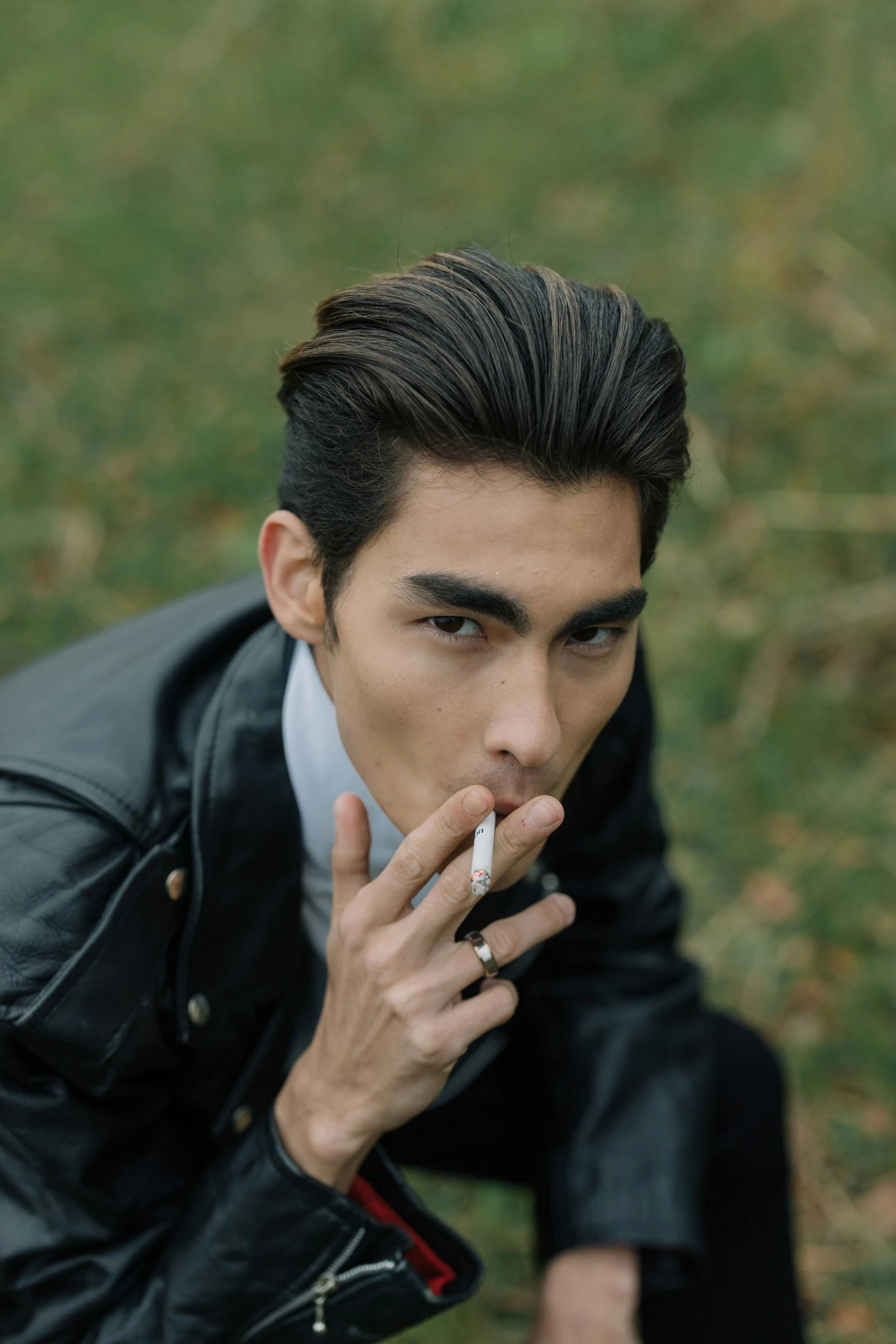 a man in a leather jacket smoking a cigarette, trending on pexels, handsome japanese demon boy, pastel', killian eng