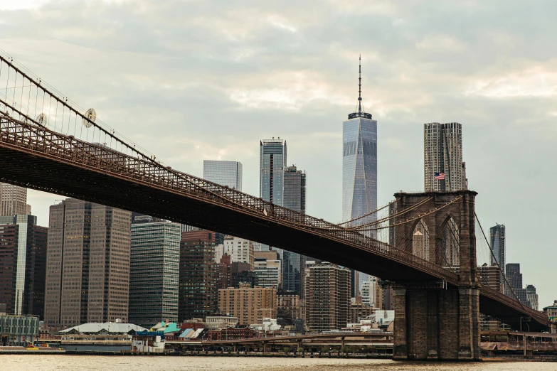 a bridge over a body of water with a city in the background, new york backdrop, high-quality photo, fan favorite, 2000s photo