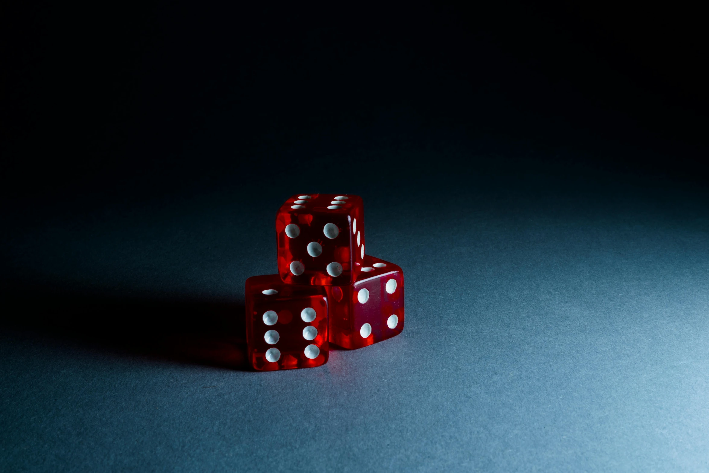 a couple of red dice sitting on top of a table