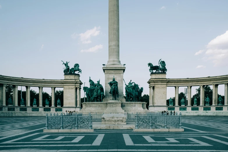 a monument with statues in the middle of it, by Adam Szentpétery, pexels contest winner, neoclassicism, square, arc, color image, ground level view