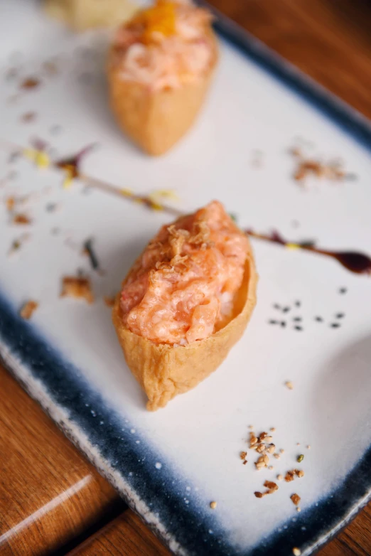 a close up of a plate of food on a table, cone shaped, soft blush, thumbnail, battered