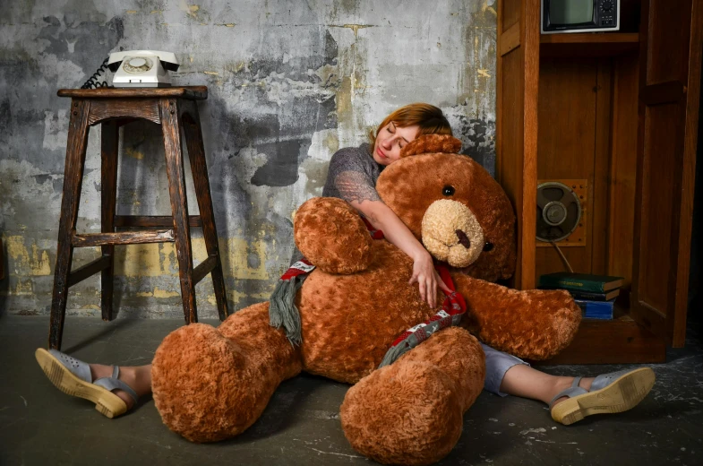 a woman sitting on the floor hugging a giant teddy bear, inspired by Sarah Lucas, pexels contest winner, action bronson, portrait of max caulfield, on location, sydney hanson