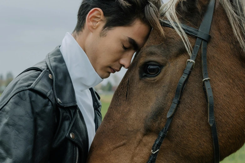 a man standing next to a brown horse, an album cover, trending on pexels, avan jogia angel, private moment, ryan jia, profile image