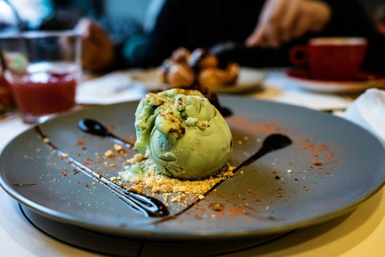 a plate with a scoop of ice cream on it, pexels contest winner, full of greenish liquid, restaurant menu photo, spherical, cake