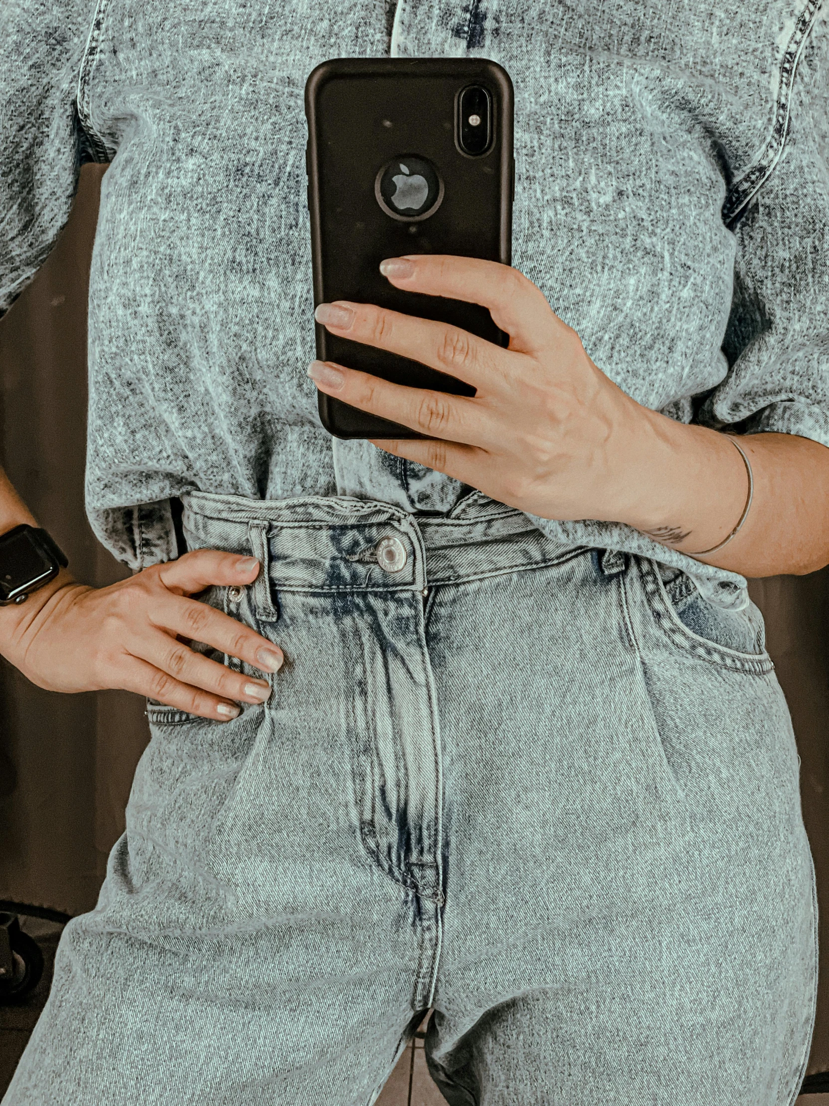 a woman taking a selfie with her cell phone, an album cover, by Robbie Trevino, trending on pexels, photorealism, worn pants, vintage closeup photograph, vintage shirt, cold as ice! 🧊
