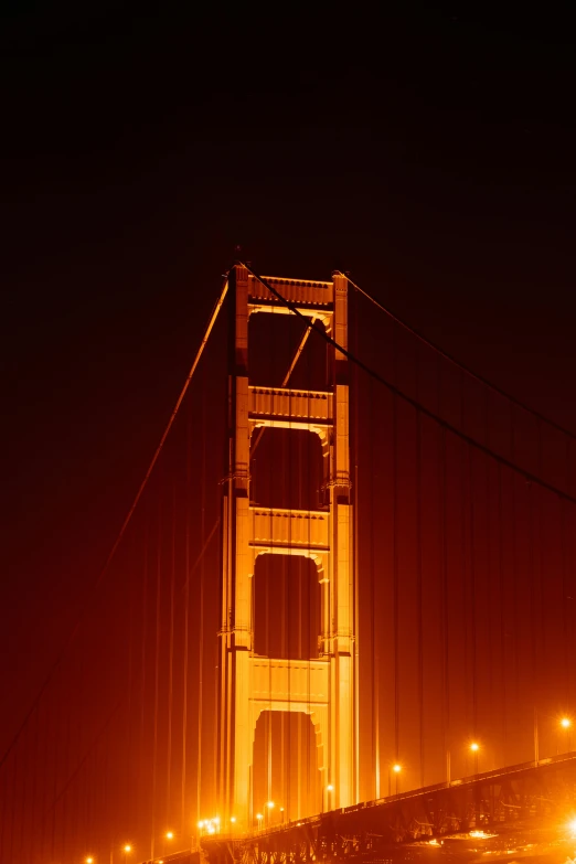 the golden gate bridge is lit up at night, an album cover, photographed for reuters, f/3.2, - n 9, extra detail