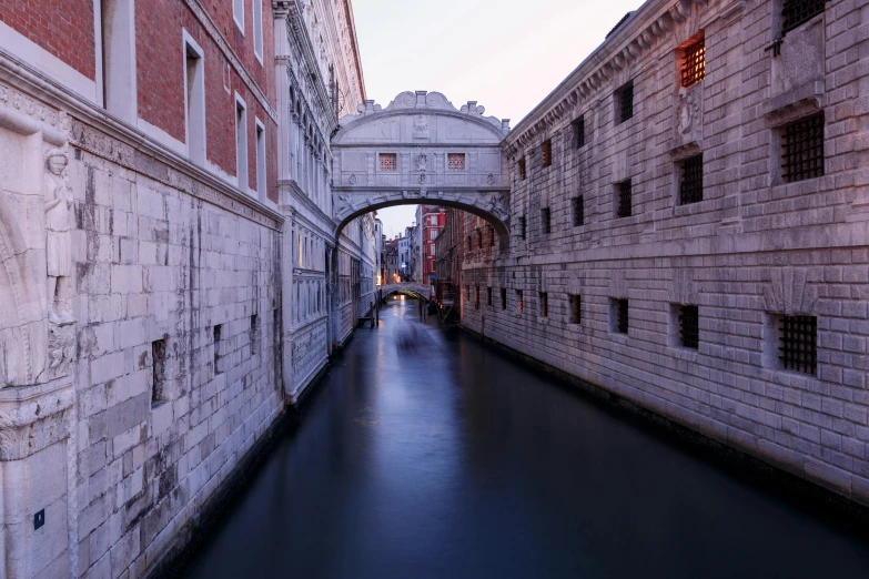 a narrow canal with a bridge over it, an album cover, by Canaletto, unsplash contest winner, renaissance, early evening, john pawson, profile image, fan favorite