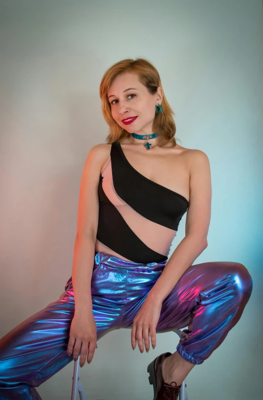 a woman sitting on top of a suitcase, a colorized photo, inspired by Julia Pishtar, holography, wearing a sexy cropped top, synthwave colors!!, blue pants, alexa grace